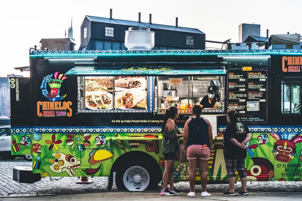 people standing at a food truck