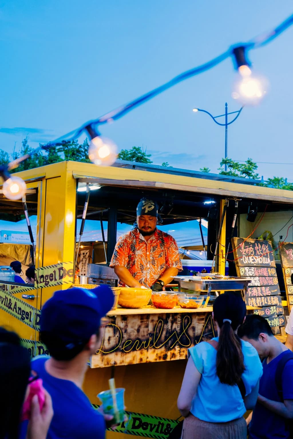 a close up of someone cooking at a food truck